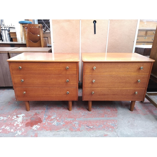 112 - A pair of mid 20th century teak chests of three drawers - approx. 57cm high x 65cm wide x 39cm deep