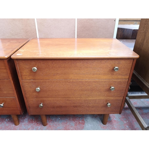 112 - A pair of mid 20th century teak chests of three drawers - approx. 57cm high x 65cm wide x 39cm deep