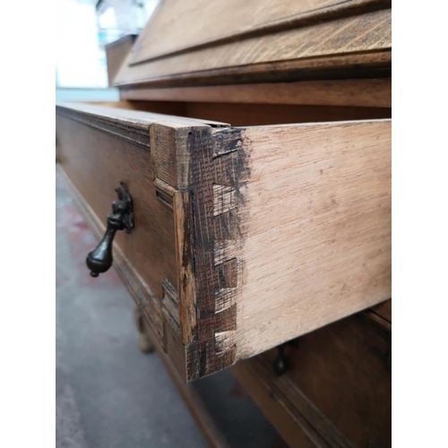 113 - An early 20th century oak geometric carved bureau with barley twist supports