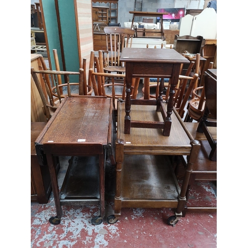 116 - Three pieces of oak furniture, two tea trolleys and one rectangular side table