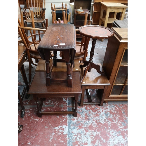 117 - Five occasional tables, four oak and one mahogany with tan leather insert