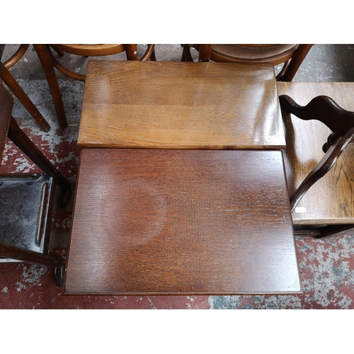 117 - Five occasional tables, four oak and one mahogany with tan leather insert