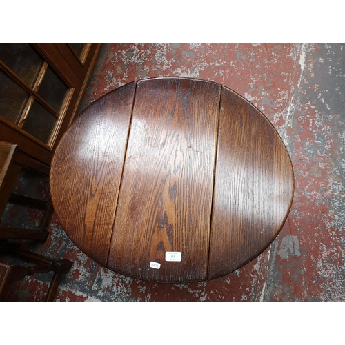 117 - Five occasional tables, four oak and one mahogany with tan leather insert