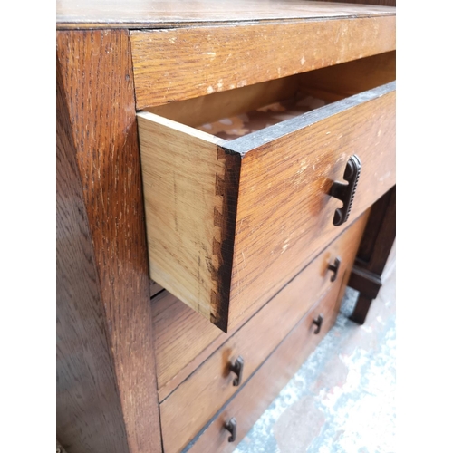 17 - An Art Deco oak chest of four drawers - approx. 87cm high x 76cm wide x 38cm deep