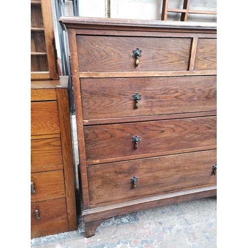 18 - An early/mid 20th century oak chest of two short over three long drawers - approx. 114cm high x 114c... 