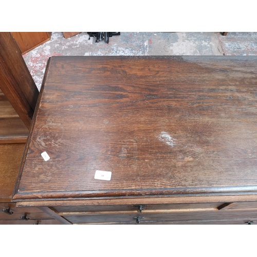 18 - An early/mid 20th century oak chest of two short over three long drawers - approx. 114cm high x 114c... 