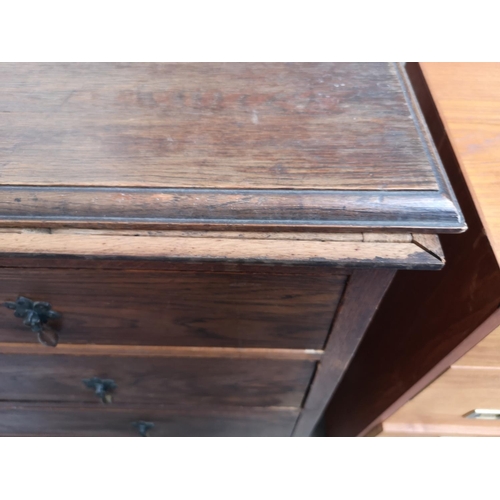 18 - An early/mid 20th century oak chest of two short over three long drawers - approx. 114cm high x 114c... 