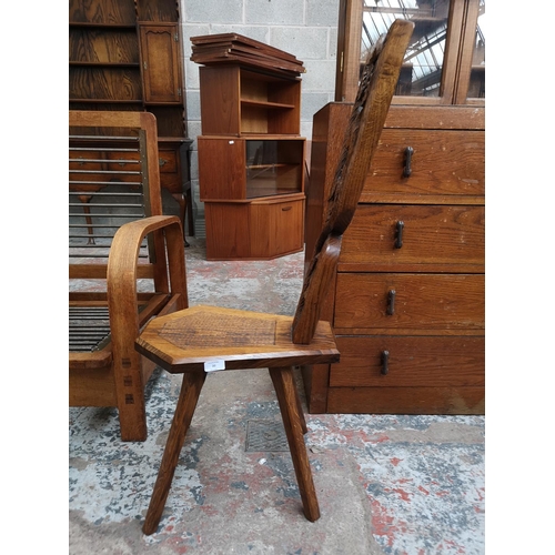 20 - A carved oak spinning chair with fox design - approx. 95cm high