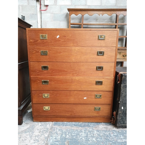 21 - A teak chest of six drawers - approx. 101cm high x 88cm wide x 40cm deep