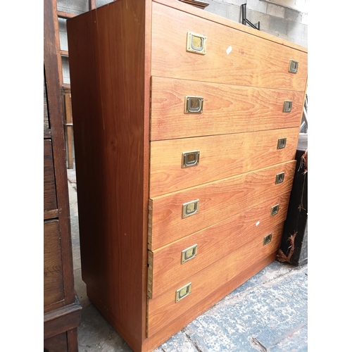 21 - A teak chest of six drawers - approx. 101cm high x 88cm wide x 40cm deep