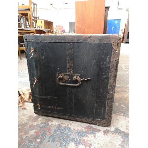 23 - An early 20th century pine travel trunk converted two door cabinet