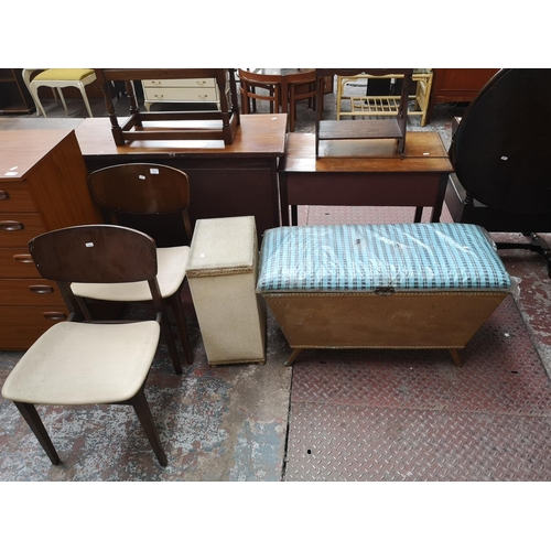 31 - Four pieces of mid 20th century furniture, two walnut and vinyl dining chairs, one Lloyd Loom style ... 