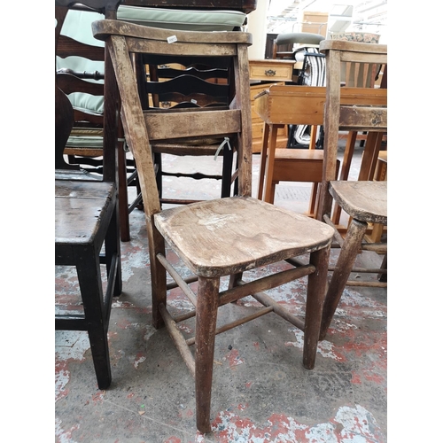 37 - Five chairs, three early 20th century elm and beech chapel chairs and two Georgian oak dining chairs