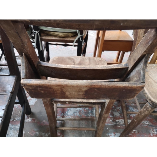 37 - Five chairs, three early 20th century elm and beech chapel chairs and two Georgian oak dining chairs