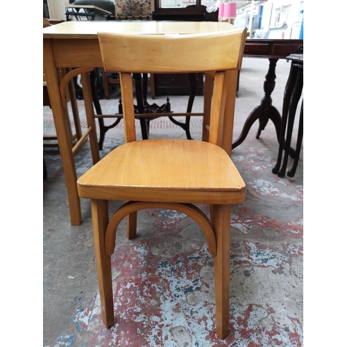 38 - Two piece of furniture, one beech child's desk and chair and one mahogany nest of three tables with ... 