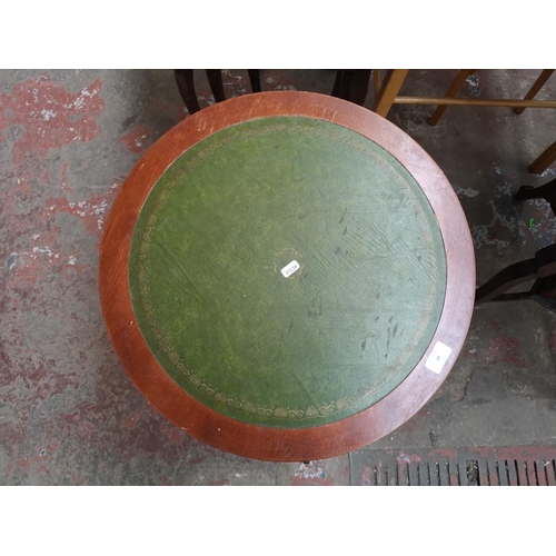 39 - A Regency style mahogany and green leather drum table