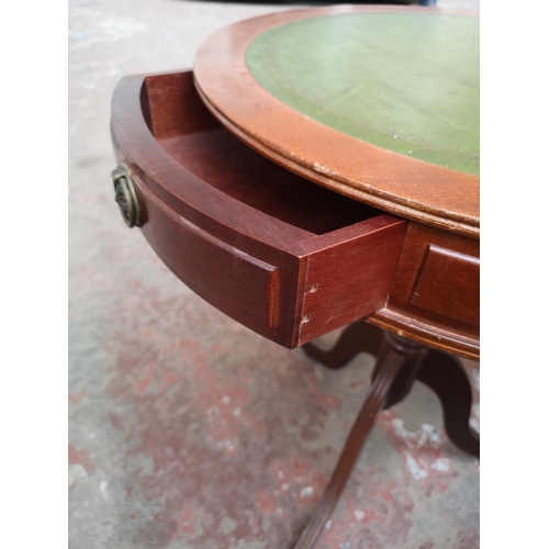 39 - A Regency style mahogany and green leather drum table