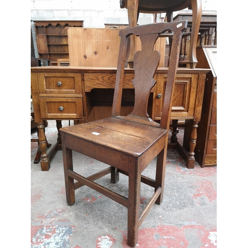 44 - A Georgian oak plank seat dining chair