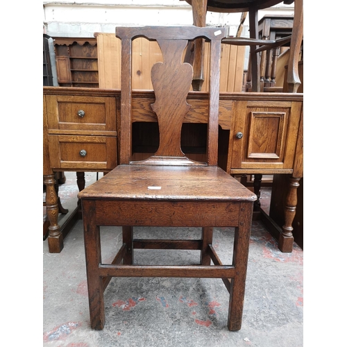 44 - A Georgian oak plank seat dining chair