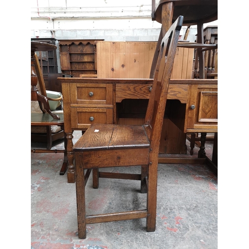 44 - A Georgian oak plank seat dining chair