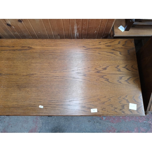 46 - An oak writing desk - approx. 75cm high x 120cm wide x 55cm deep