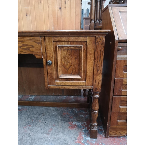 46 - An oak writing desk - approx. 75cm high x 120cm wide x 55cm deep