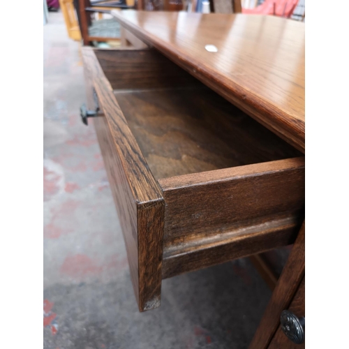 46 - An oak writing desk - approx. 75cm high x 120cm wide x 55cm deep