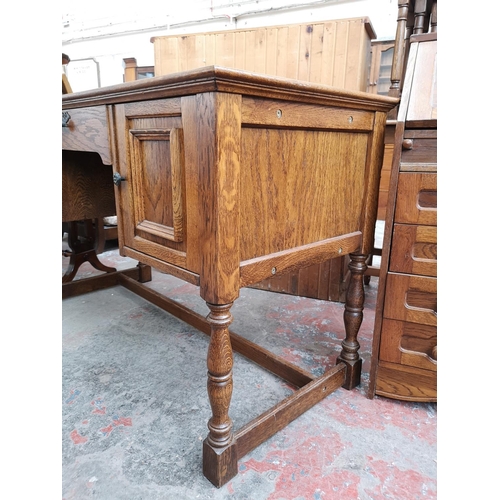 46 - An oak writing desk - approx. 75cm high x 120cm wide x 55cm deep