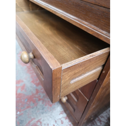 47 - An oak bureau with four drawers and fall front - approx. 91cm high x 80cm wide x 43cm deep