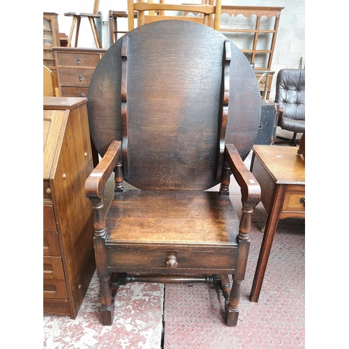 48 - A mid 20th century oak monk's seat - approx. 126cm high x 87cm wide x 60cm deep