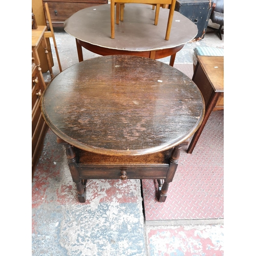 48 - A mid 20th century oak monk's seat - approx. 126cm high x 87cm wide x 60cm deep