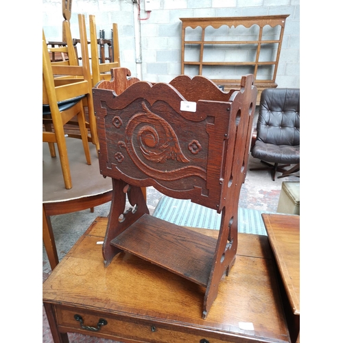 49 - A vintage carved oak magazine rack - approx. 67cm high x 40cm wide x 23cm deep