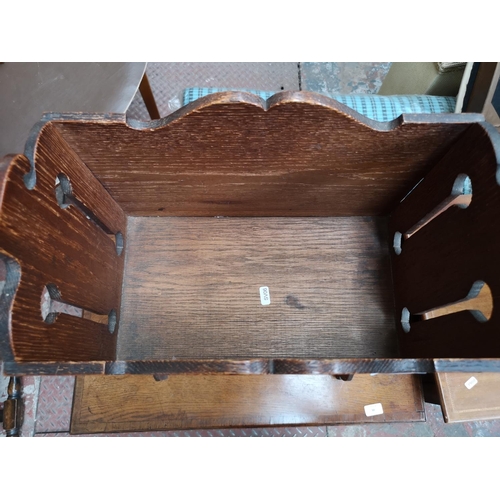 49 - A vintage carved oak magazine rack - approx. 67cm high x 40cm wide x 23cm deep