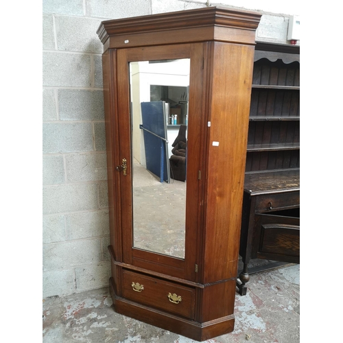 5 - An early 20th century mahogany corner gentleman's wardrobe - approx. 200cm high