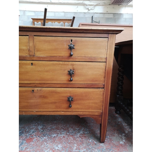 52 - An Edwardian inlaid mahogany chest of two short over two long drawers - approx. 79cm high x 107cm x ... 