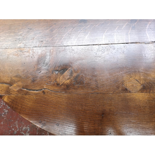 53 - A 17th century style solid oak bobbin turned drop leaf gate leg dining table - approx. 74cm high x 1... 