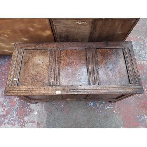 55 - A 19th century oak three panel coffer - approx. 65cm high x 118cm wide x 54cm deep