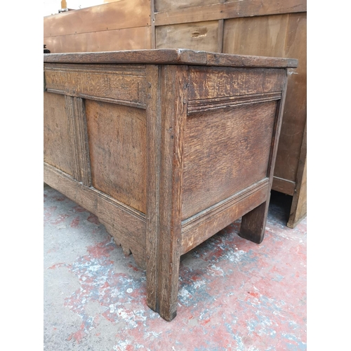 55 - A 19th century oak three panel coffer - approx. 65cm high x 118cm wide x 54cm deep