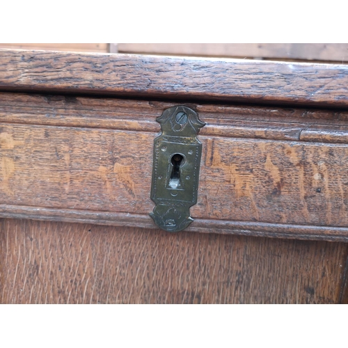 55 - A 19th century oak three panel coffer - approx. 65cm high x 118cm wide x 54cm deep