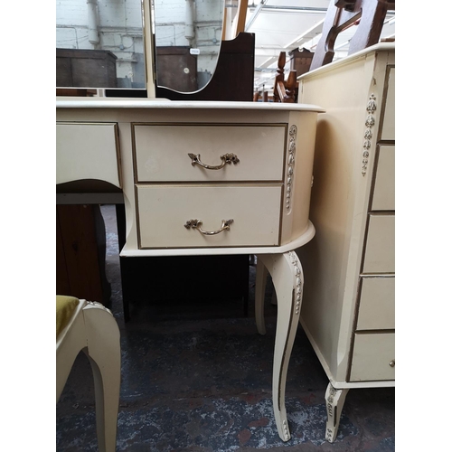 58 - A French style white painted kidney shaped dressing table with three section bevelled edge mirror an... 