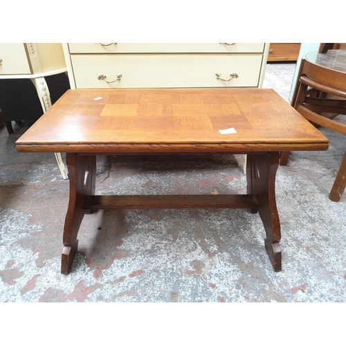 59 - A carved oak rectangular coffee table with fish design - approx. 47cm high x 39cm wide x 69cm long