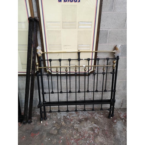 6 - A Victorian brass and black metal double bed frame