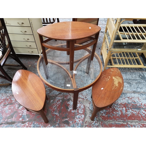 62 - A Nathan teak and glass Trinity coffee table with three nesting tables - approx. 51cm high x 81cm di... 