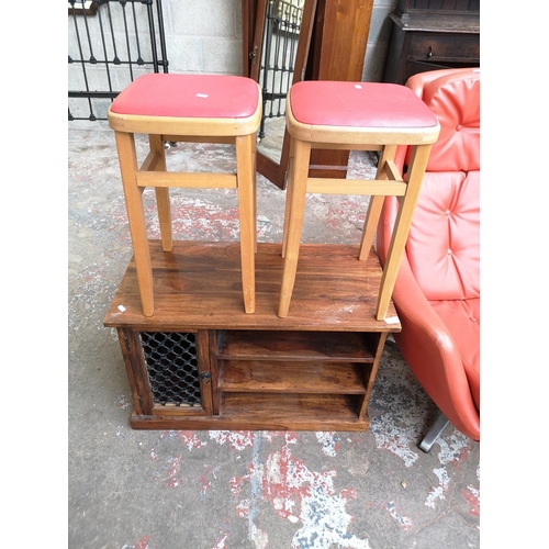 8 - Three pieces of furniture, two mid 20th century beech and red vinyl stools and one Indian sheesham w... 