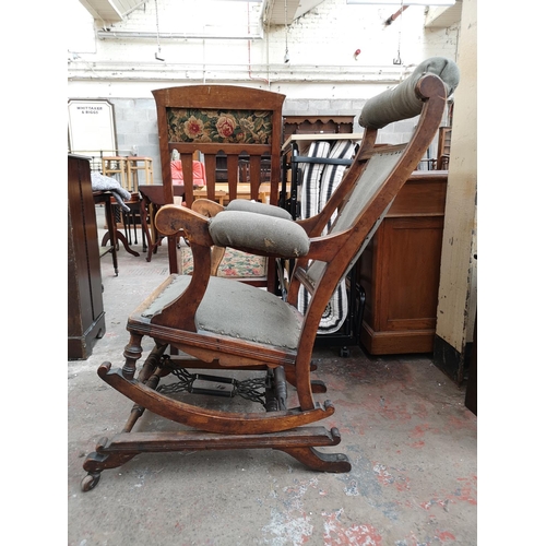 80 - An early 20th century American beech and green fabric upholstered rocking chair