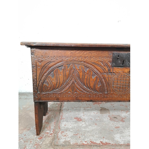 83 - A 17th century carved oak sword chest - approx. 52cm high x 100cm wide x 40cm deep