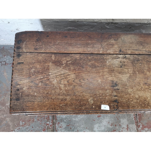 83 - A 17th century carved oak sword chest - approx. 52cm high x 100cm wide x 40cm deep