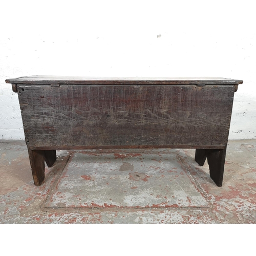 83 - A 17th century carved oak sword chest - approx. 52cm high x 100cm wide x 40cm deep