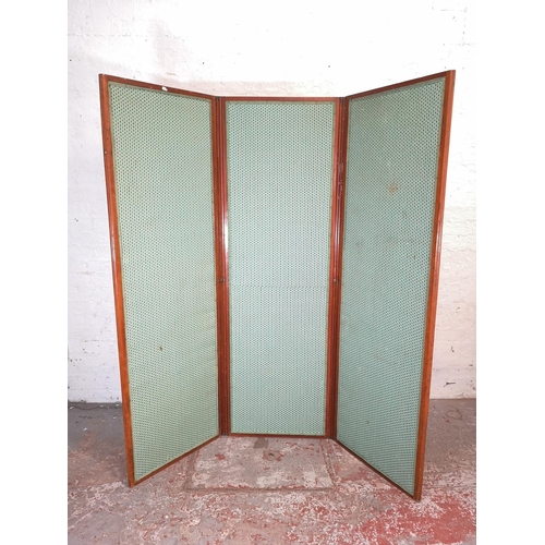 91 - An early 20th century mahogany and fabric upholstered three section folding dressing screen - approx... 