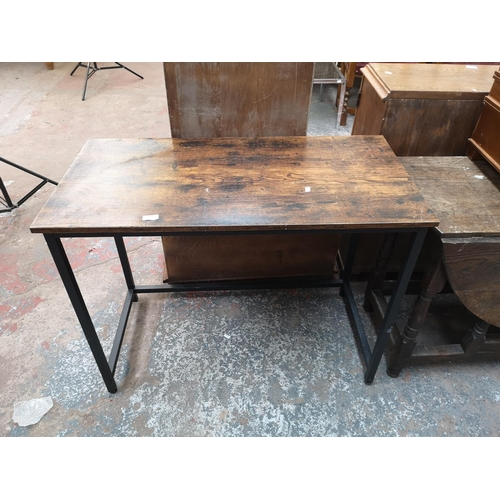 96 - A modern oak effect and black metal rectangular console table - approx. 76cm high x 100cm wide x 50c... 